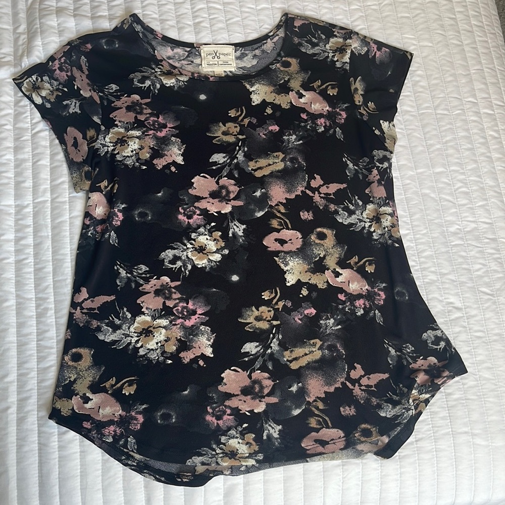 Brand is pen and paper it’s a medium and it’s black with flowers